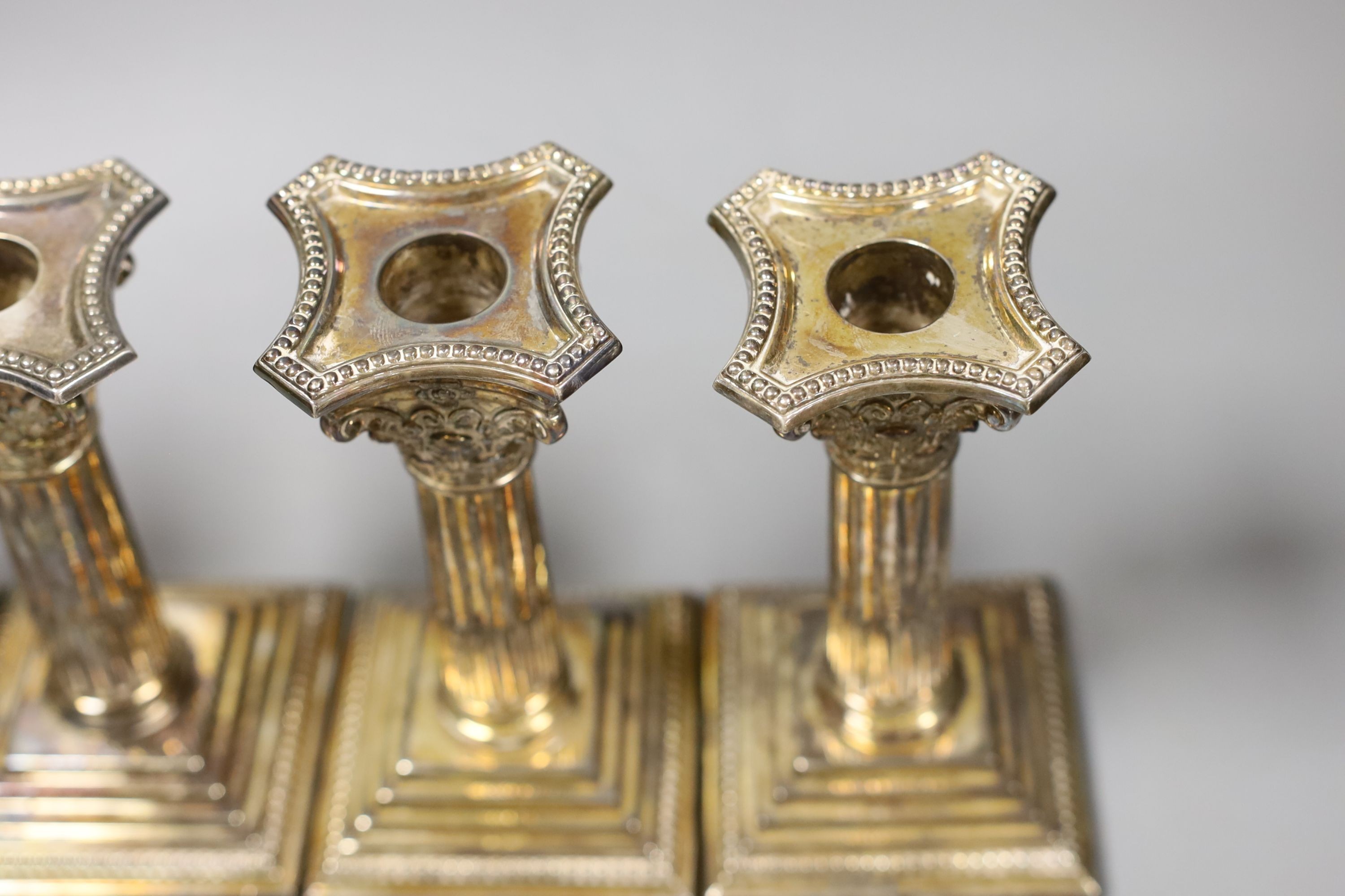 A set of four modern silver Corinthian column dwarf candlesticks, James Dixon & Sons, Sheffield, 1972, weighted, 14.5cm.